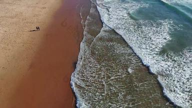 热带海滩空中视图前视图波打破热带黄色的沙子海滩海波无缝的循环美丽的沙子海滩美丽的热带海滩空中鸟的眼睛视图海洋波